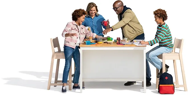 A family of four enjoys breakfast.